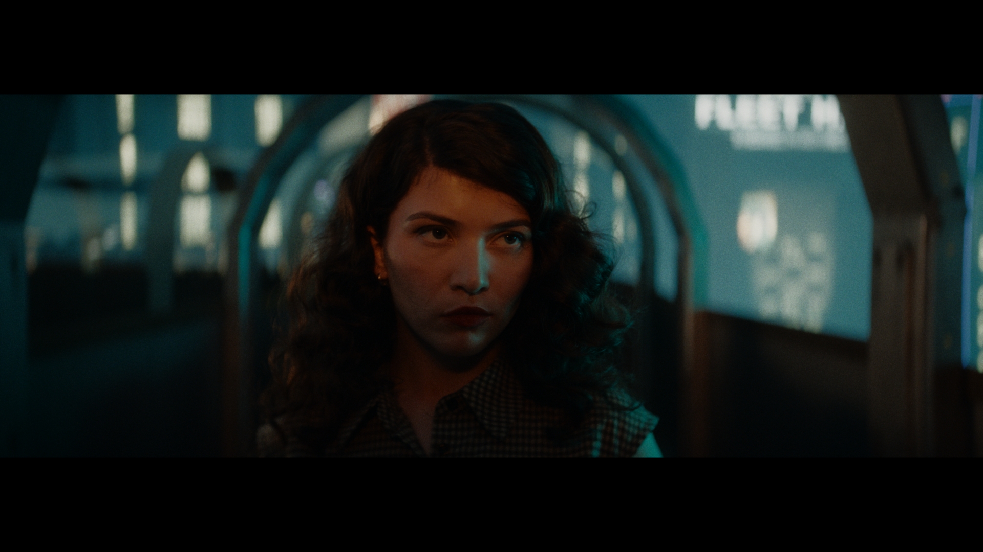A porthole looking out over the lights of Rapture